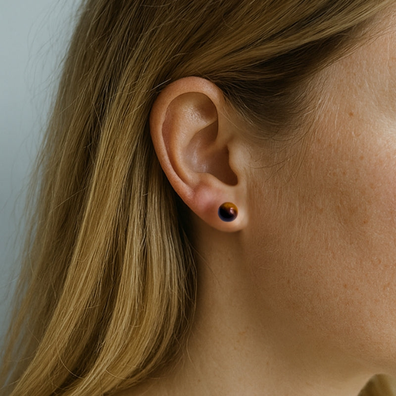 Puces d’oreilles | Œil du Tigre : Protection et confiance