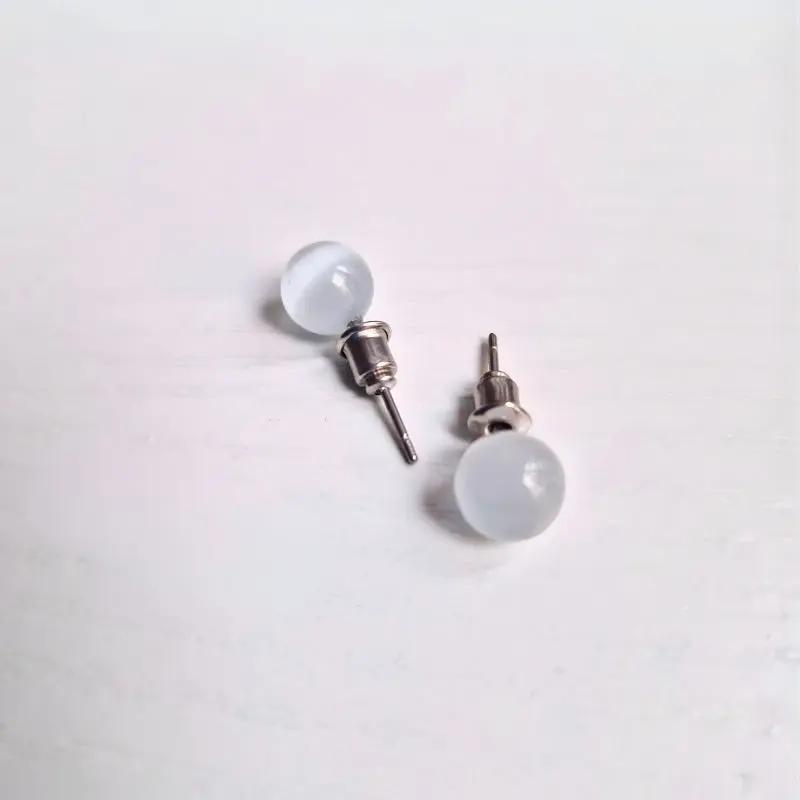 Puces d’oreilles  Œil de Chat : Intuition et protection Zelia Paris